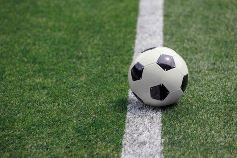 A ball in the middle of a soccer field
