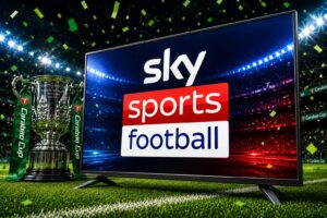 Carabao Cup trophy behind a large television showing the Sky Sports Football logo inside a floodlit stadium with green confetti.